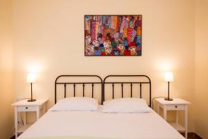 Postel nebo postele na pokoji v ubytování Corte dei Nobili Apartment