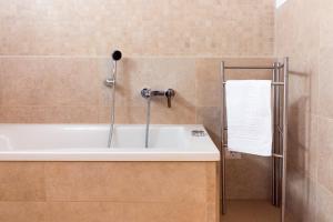 Koupelna v ubytování Corte dei Nobili Apartment + 20 fotografií