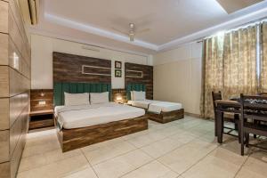 Postel nebo postele na pokoji v ubytování Hotel Highway king Behror
