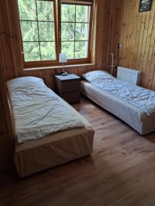 Posteľ alebo postele v izbe v ubytovaní Agroturystyka OdważnyTeam