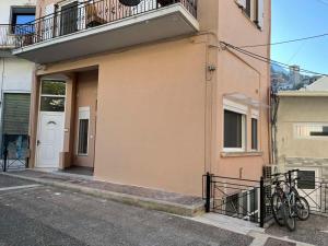 a bike parked on the side of a building at Home-1611 in Paramythia