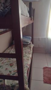 a room with a bunk bed and a bunk bed gmaxwell gmaxwell gmaxwellythonythonython at Golden Dunas 123B in Extremóz
