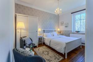 Postel nebo postele na pokoji v ubytování Hotel Villa Wahnfried Thiessow
