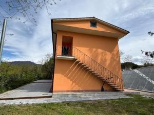 a house with a staircase on the side of it at Tenuta Vinci in Capannori