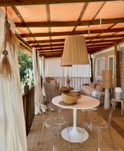 a living room with a table and chairs at Chiclavie in La Celle-sous-Gouzon