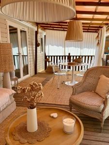 a living room with a couch and a table at Chiclavie in La Celle-sous-Gouzon