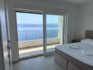 Postel nebo postele na pokoji v ubytování Elona Apartments