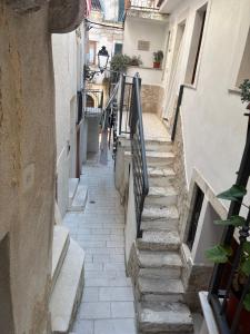 an alley with stairs in an old building at La Casetta in Ischitella