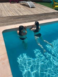 two women in the water in a swimming pool at Chiclavie in La Celle-sous-Gouzon +9 photos