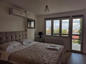 Postel nebo postele na pokoji v ubytování City Peaks Apartments