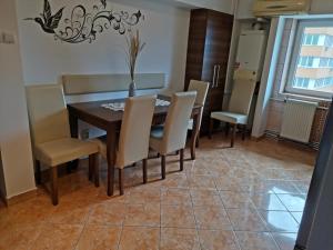 a dining room with a table and chairs at House Teo in Văleni