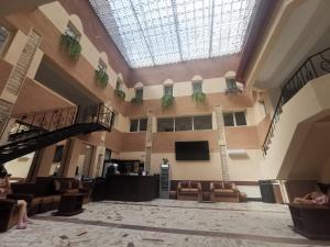 a large lobby with a skylight and a skylight at For Fun resort naturist libertin - adults only in Costinesti