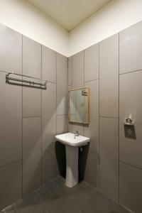 a bathroom with a sink and a mirror at Breeze Resort Panhala , Just 5 Minutes From Panhala! in Panhāla