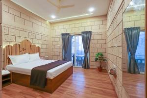 a bedroom with a bed and a window at Breeze Resort Panhala , Just 5 Minutes From Panhala! in Panhāla +24 photos
