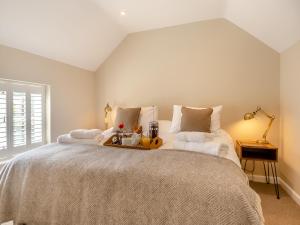 Voodi või voodid majutusasutuse Stable Cottage toas