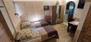 Posteľ alebo postele v izbe v ubytovaní Apartamenty w Centrum - Zakopane
