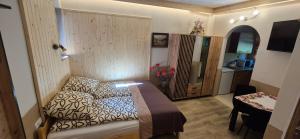 Posteľ alebo postele v izbe v ubytovaní Apartamenty w Centrum - Zakopane