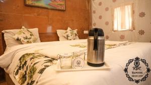 A bed or beds in a room at Rajputana Desert Camp