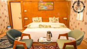A bed or beds in a room at Rajputana Desert Camp