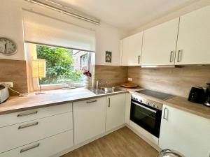 Η κουζίνα ή μικρή κουζίνα στο 1015 - Haus Tuskulum