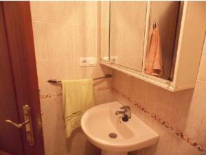 a bathroom with a sink and a mirror at Torrox costa apartamento in Torrox Costa +20 photos