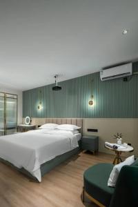 Postelja oz. postelje v sobi nastanitve Locals Inn Guangzhou New Baiyun International Airport Airport Branch