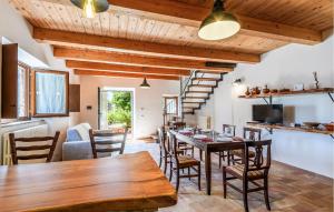 a kitchen and dining room with a table and chairs at Gorgeous Home In Loc Avenale, Cingoli in Avenale