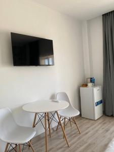 TV a/nebo společenská místnost v ubytování Guest House “Aura”