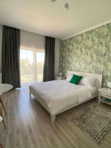 Postel nebo postele na pokoji v ubytování Guest House “Aura”