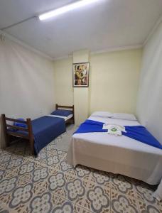 En eller flere senge i et værelse på Pousada São Benedito + 25 billeder