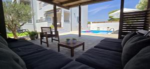 a living room with a couch and a table at Apartment Alicia with private pool in Vodice
