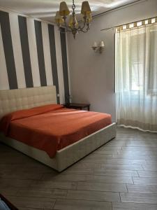 Posteľ alebo postele v izbe v ubytovaní La casa del marchese Malaspina