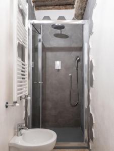 a bathroom with a shower with a toilet and a sink at Vista sul Borgo in Monte San Savino +22 photos