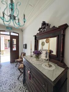 a room with a dresser with a mirror on it at Vasiliki Konak Otel in Bozcaada