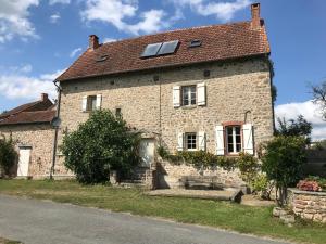 an old stone house with a solar roof at La Terrade in Saint-Hilaire-La-Treille