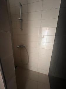 a bathroom with a shower with a glass door at Sea View Apartments in Herceg-Novi