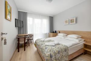 Postel nebo postele na pokoji v ubytování Bumerang