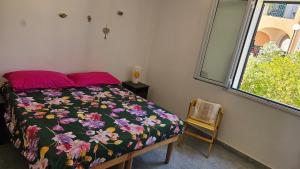 En eller flere senge i et værelse på Mancini house