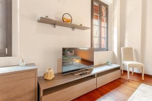 Μια τηλεόραση ή/και κέντρο ψυχαγωγίας στο Ferrara Prestige - Stile & Comfort nel cuore Estense