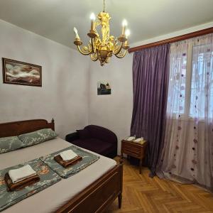 Postel nebo postele na pokoji v ubytování Tbilisi Guest House