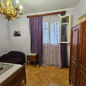 Postel nebo postele na pokoji v ubytování Tbilisi Guest House