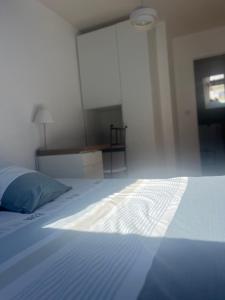 Postel nebo postele na pokoji v ubytování Le Loft, l'annexe
