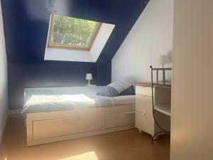Postel nebo postele na pokoji v ubytování Le Loft, l'annexe