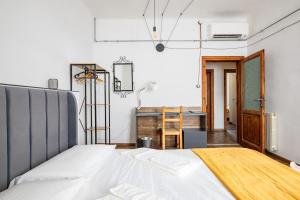a bedroom with a bed and a desk at Leaning Tower Cozy 3 Bedroom Holiday Home in Pisa