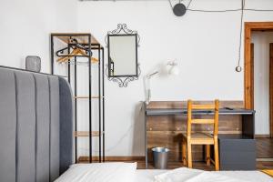 a bedroom with a desk and a chair at Leaning Tower Cozy 3 Bedroom Holiday Home in Pisa