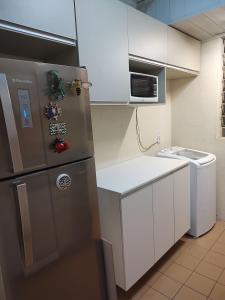 Kuchyň nebo kuchyňský kout v ubytování Cozy apartment