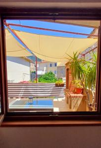 a view from a window of a swimming pool at Apartment Diana in Komiža +32 photos