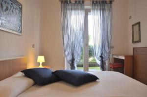 Posteľ alebo postele v izbe v ubytovaní Apartments in Lazise - Gardasee 30250