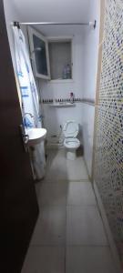 a small bathroom with a toilet and a sink at Bab bhar sousse in Sousse