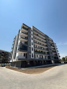 a large apartment building on the side of a street at Noble Stay in Saturn